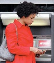 Woman using Eastern bank SUM ATM