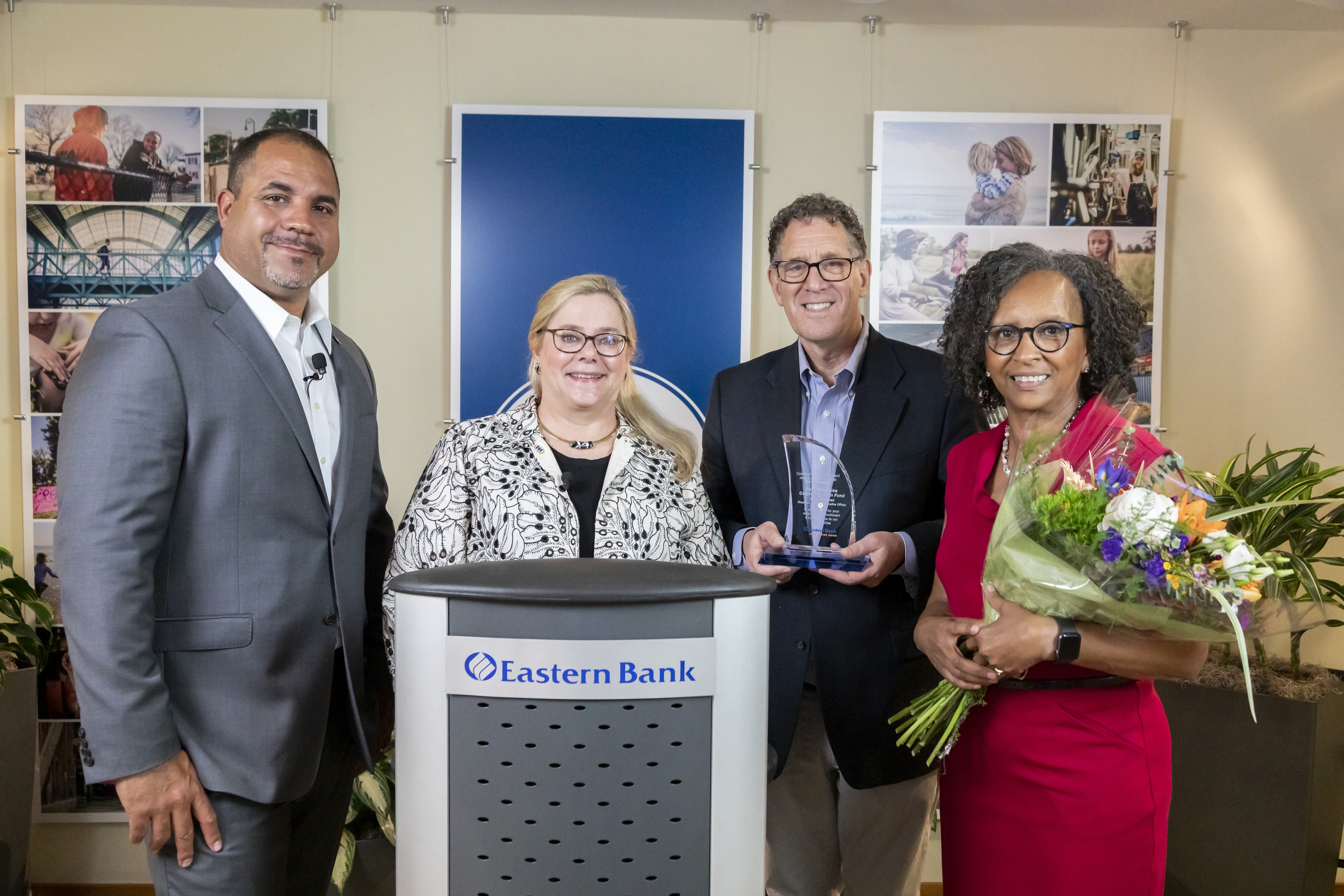 Eastern Bank's Quincy Miller and Cynthia Ciman stand with New Hampshire Community Loan Fund award winners