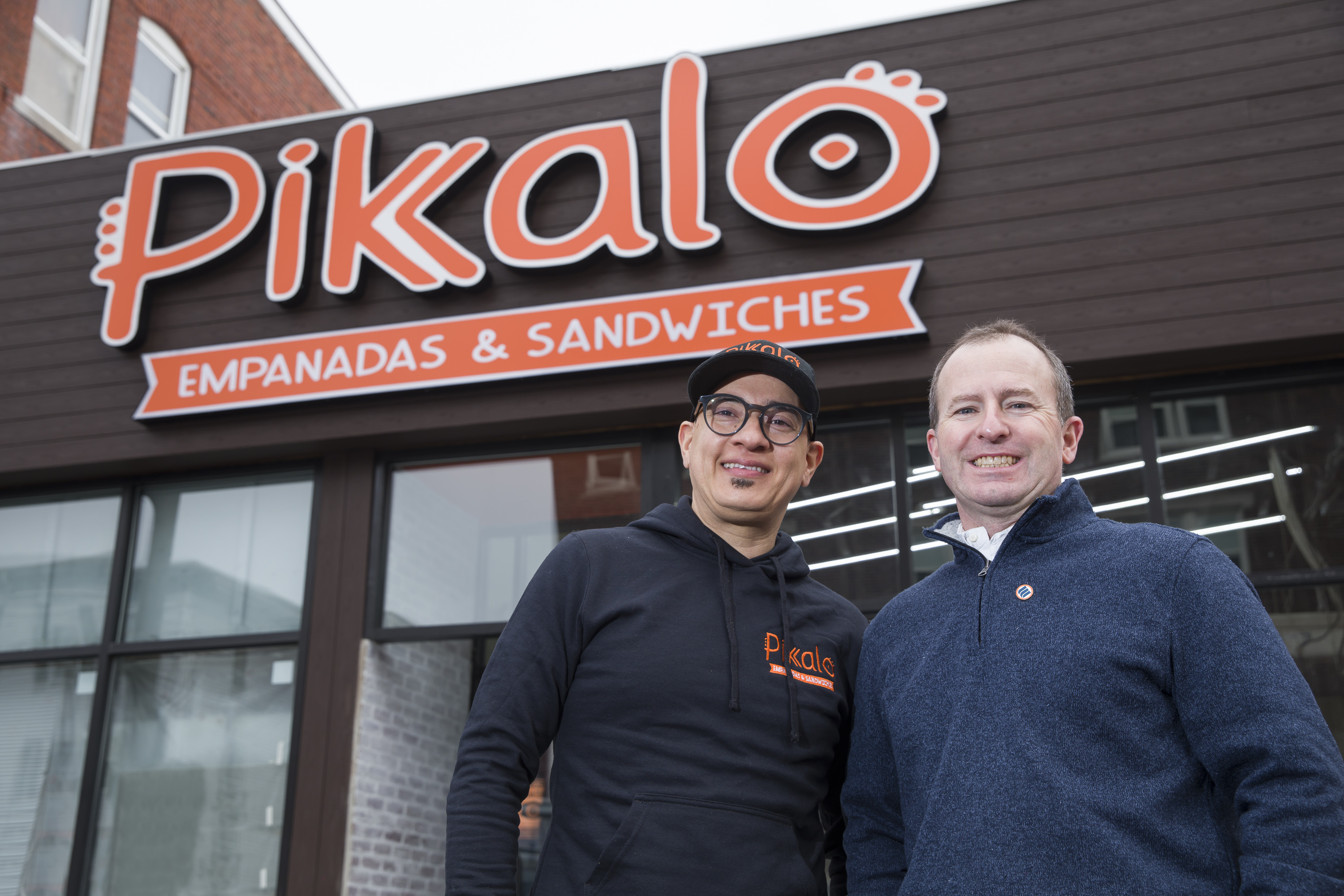 Pikalo owner Jose Pimentel stands outside of his restaurant with his Eastern Bank Relationship Manager