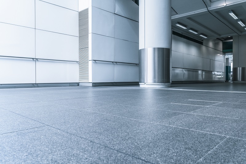 A view from the ground level of a stone floor in an office building