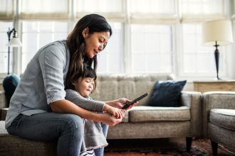 Woman sitting with mobile phone