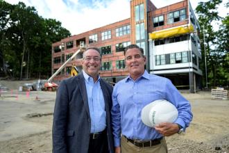 Eastern Bank Commercial Real Estate Director Nicholas Moise and The Heritage Companies President Michael Kiley.