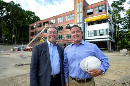 Eastern Bank Commercial Real Estate Director Nicholas Moise and The Heritage Companies President Michael Kiley.