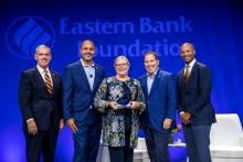 Nancy stands with her award next Denis Sheahan, Quincy Miller, Bob River, and Rahn Dorsey