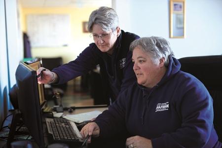 Sue and Vicki Chapman Looking at Computer